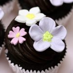 chocolate cupcake with chocolate icing and gumpaste flowers