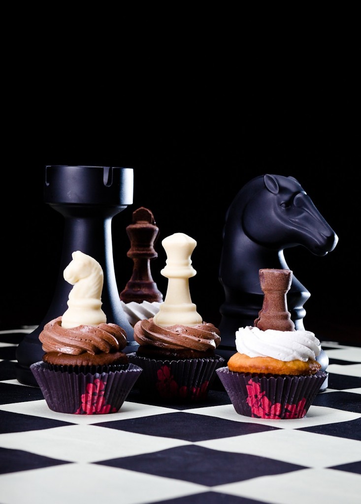 cupcakes topped with chocolate chess pieces