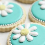 teal daisy decorated cookies