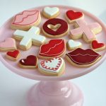 valentine decorated cookies on cake tier