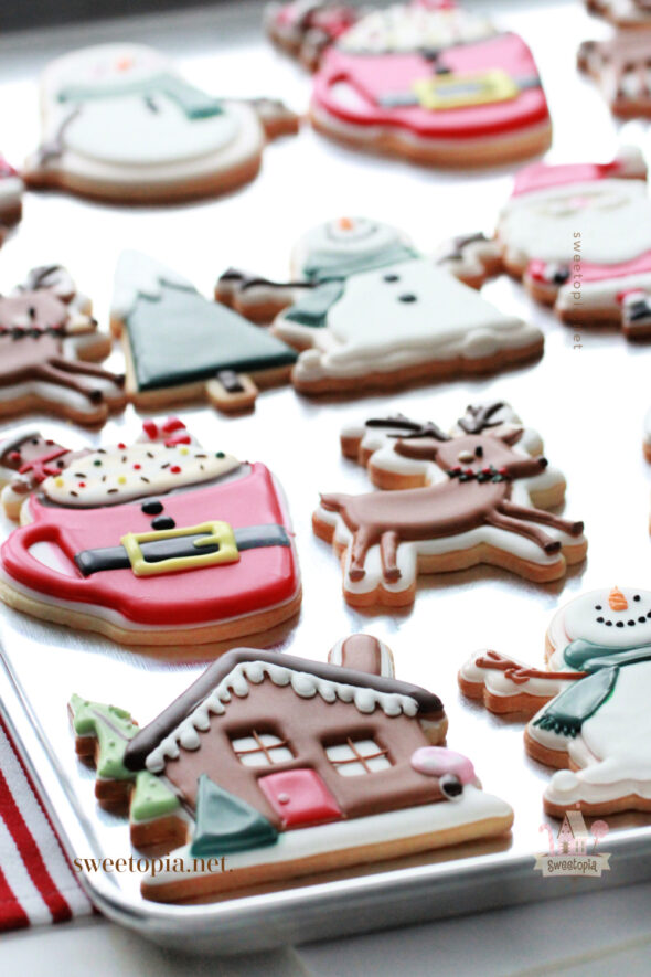 decorated christmas cookies on tray
